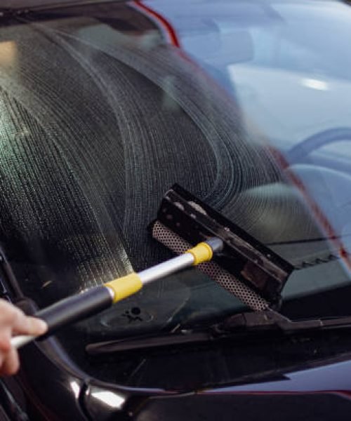 washing the windshield at the gas station washing the windshield at the gas station